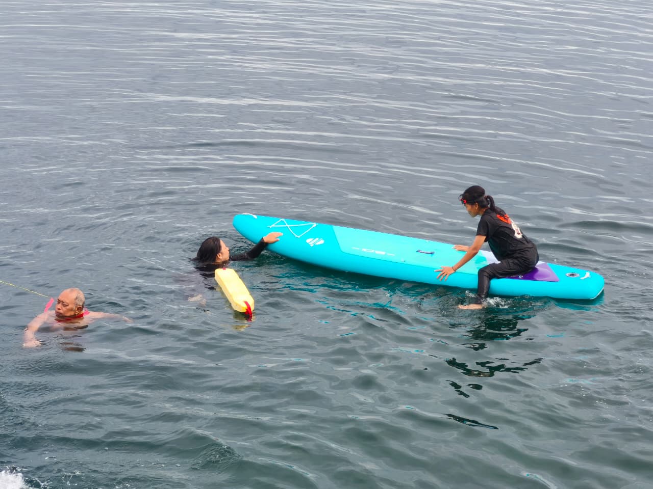 Water rescue using a rescue board is a technique where the rescuer uses a specially designed flotation board to reach, stabilize, and transport a victim safely back to shore.
